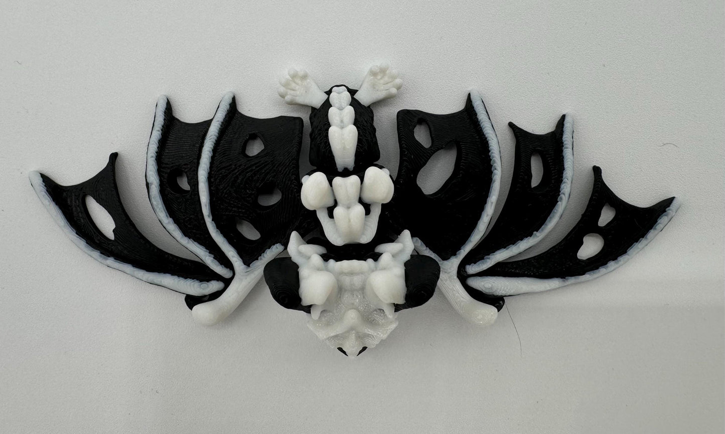 Articulating fidget “hollow bat” toy