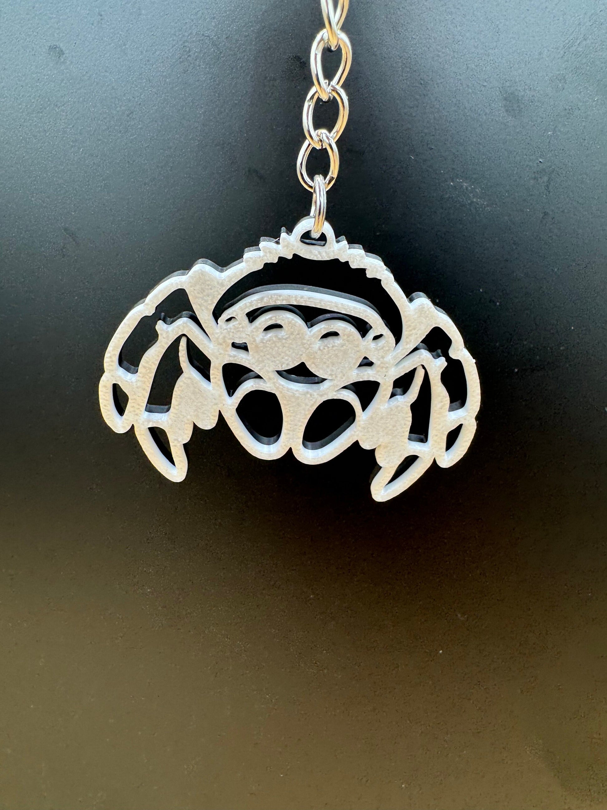 Black/White “switch” double sided Jumping Spider Keychain