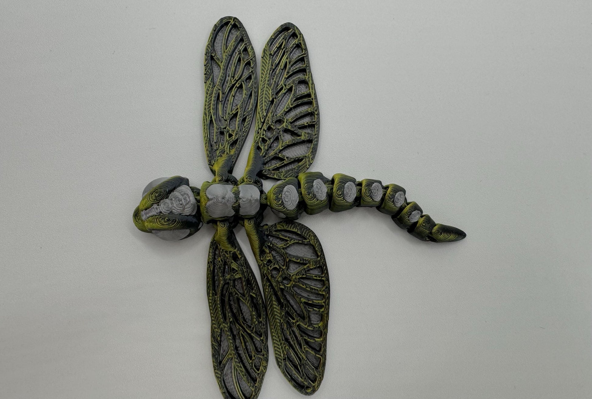 Articulating fidget dragonfly