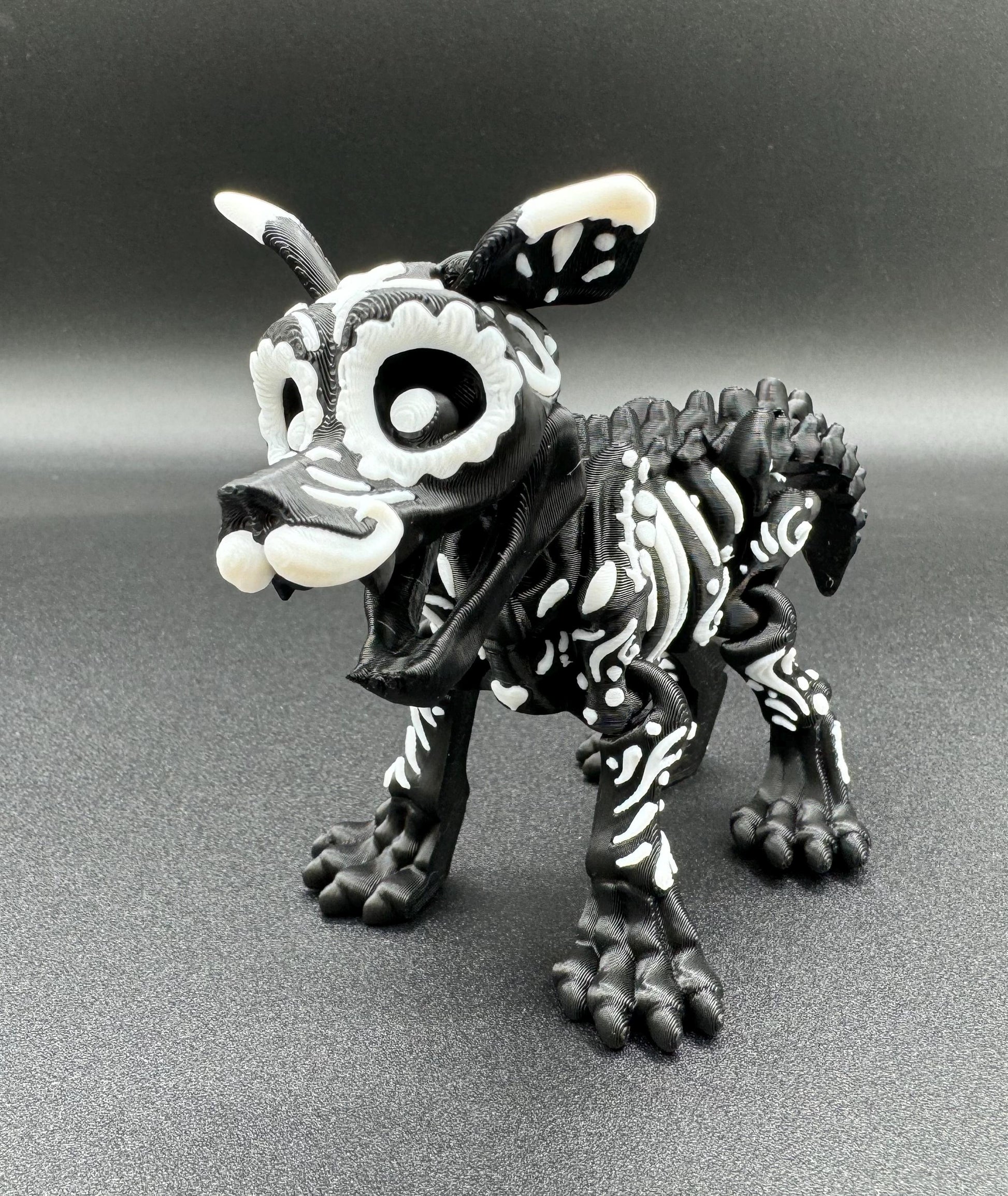 Articulating 3-D printed fidget bone sugar skull animals