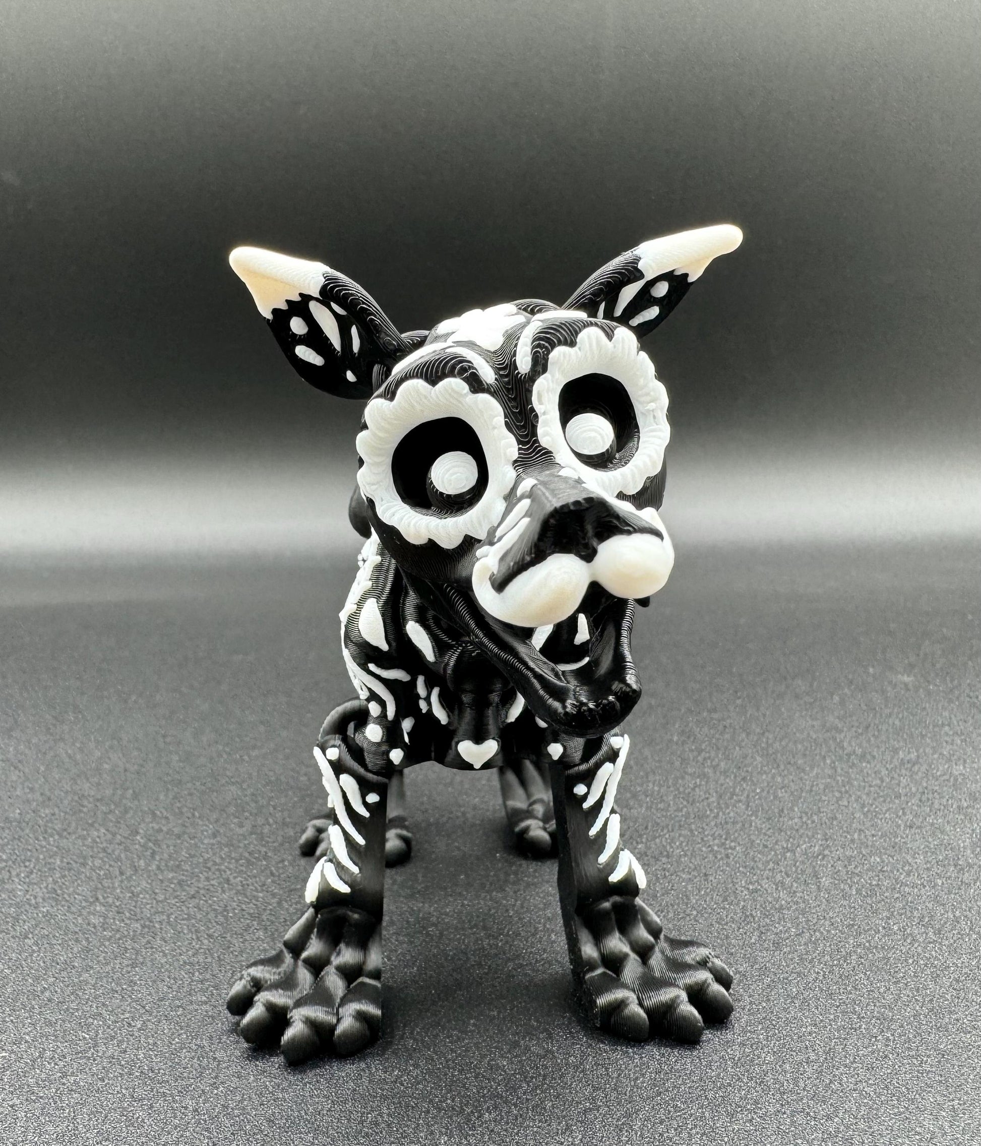 Articulating 3-D printed fidget bone sugar skull animals