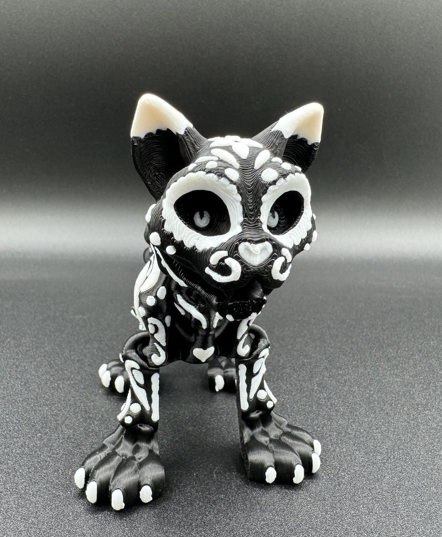 Articulating 3-D printed fidget bone sugar skull animals