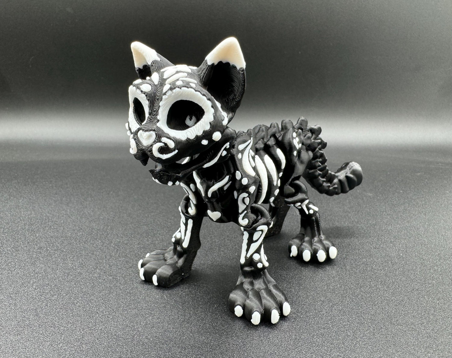 Articulating 3-D printed fidget bone sugar skull animals