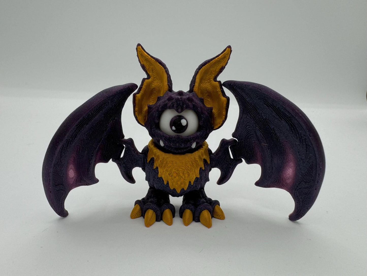 Articulating fidget bat with movable eye