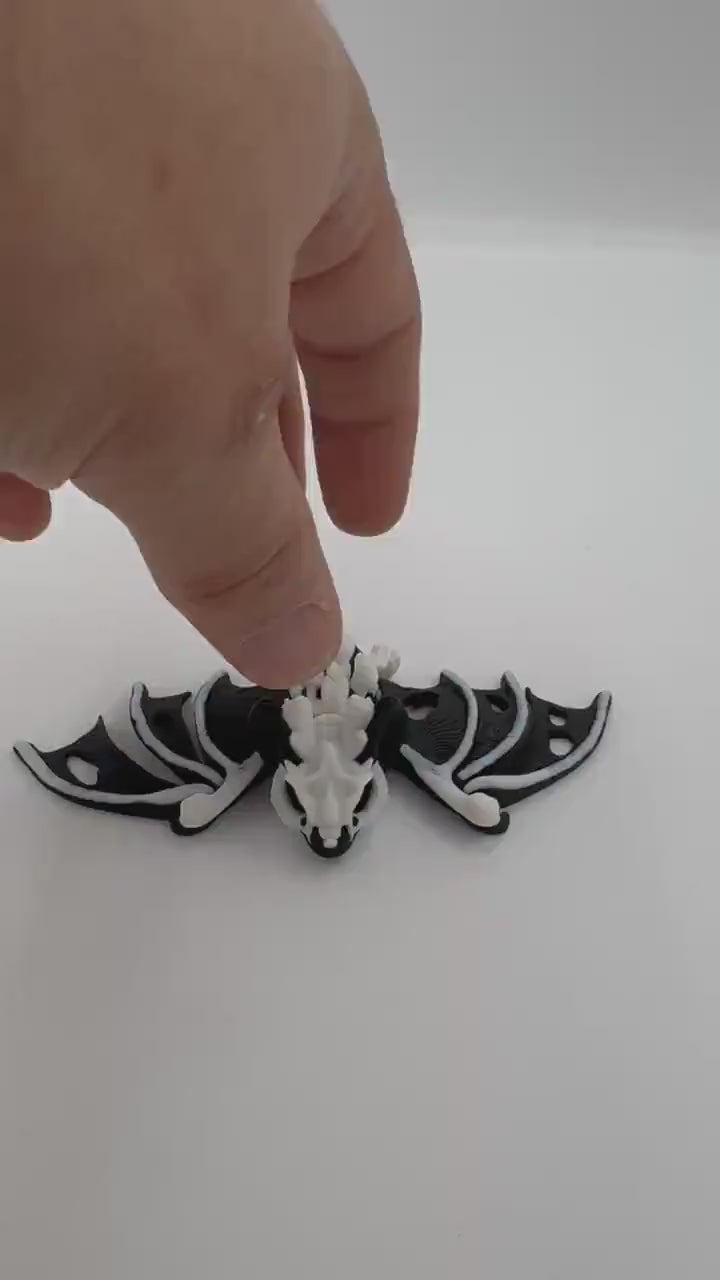 Articulating fidget “hollow bat” toy